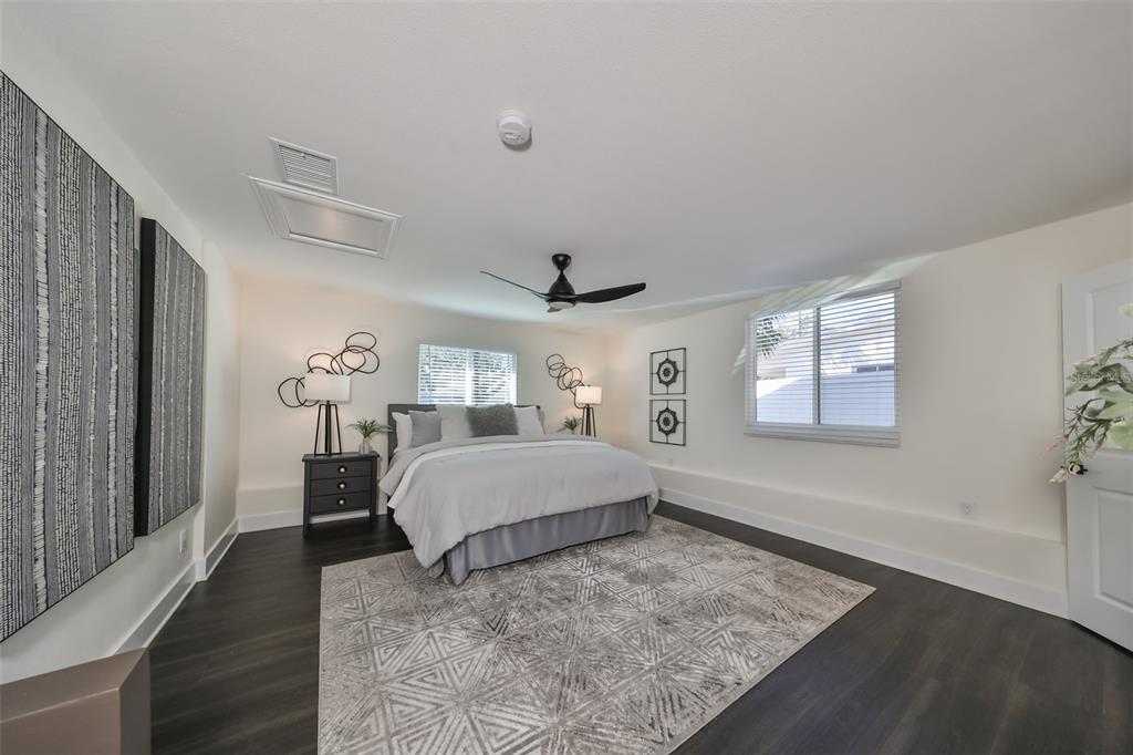 1846 3rd Street South St. Petersburg, FL 33705 - Photo 30 of 40 a spacious bedroom with a bed and a window