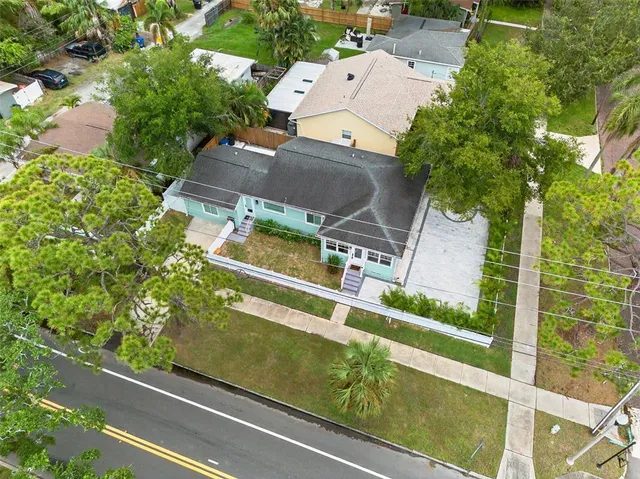 an aerial view of residential house with outdoor space