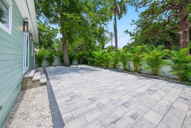 a view of a backyard of the house