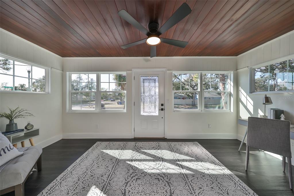 1846 3rd Street South St. Petersburg, FL 33705 - Photo 8 of 40 a bedroom with a bed and wooden floor