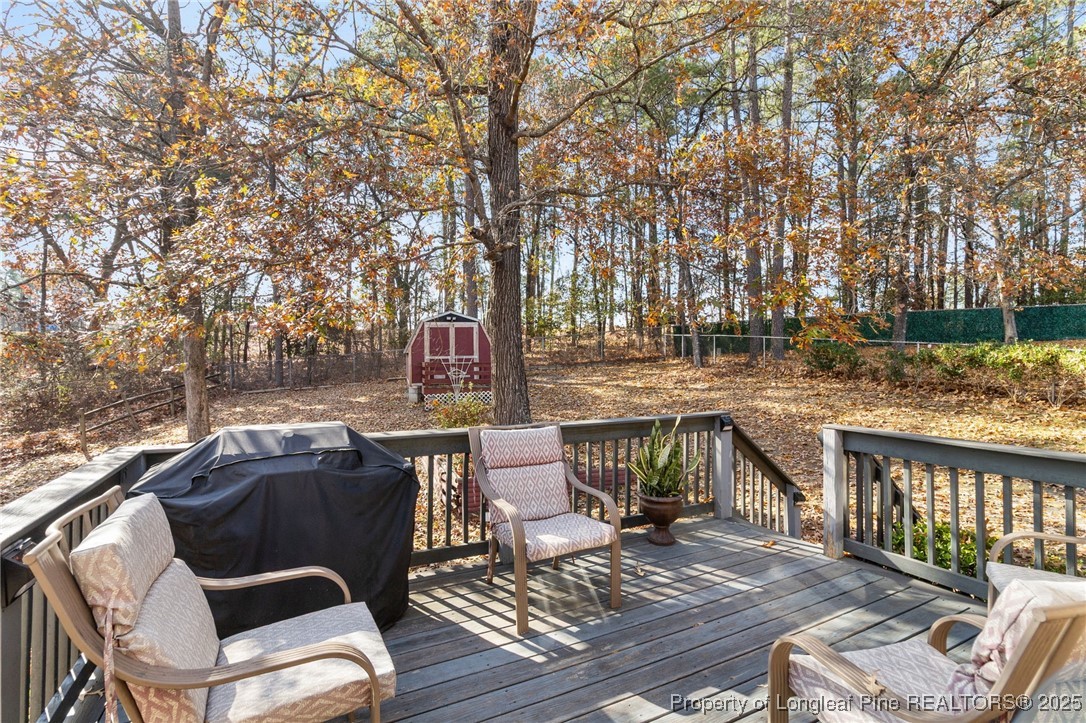 5004 Summer Ridge Road Fayetteville, NC 28303 - Photo 26 of 31 a view of a patio on the roof deck