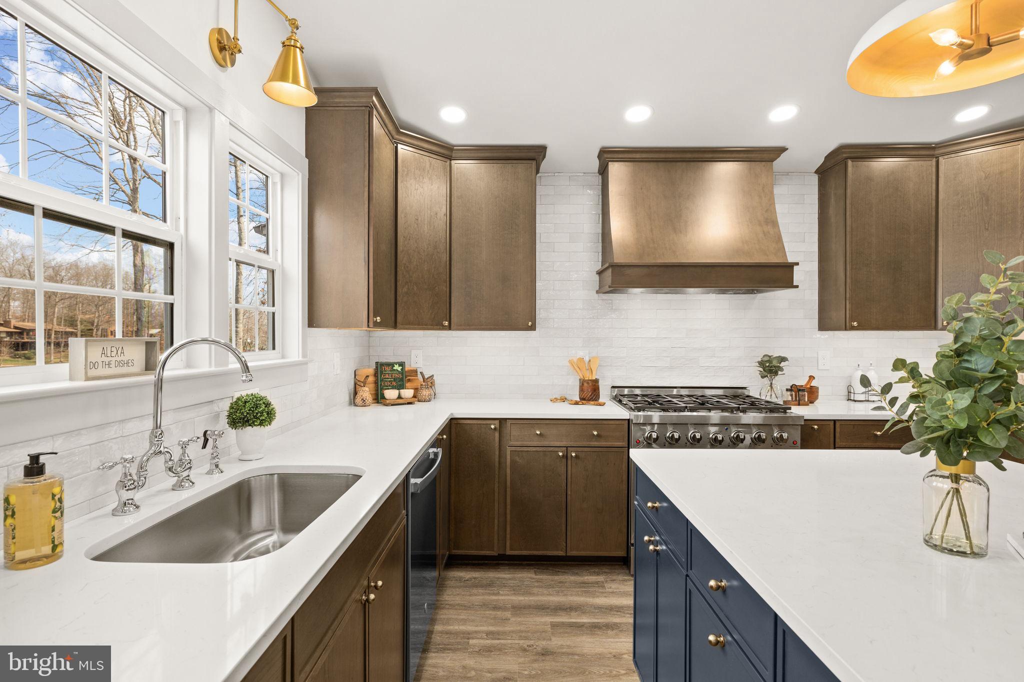 116 Washington Street Locust Grove, VA 22508 - Photo 31 of 130 a kitchen with a sink and a stove top oven with wooden floor