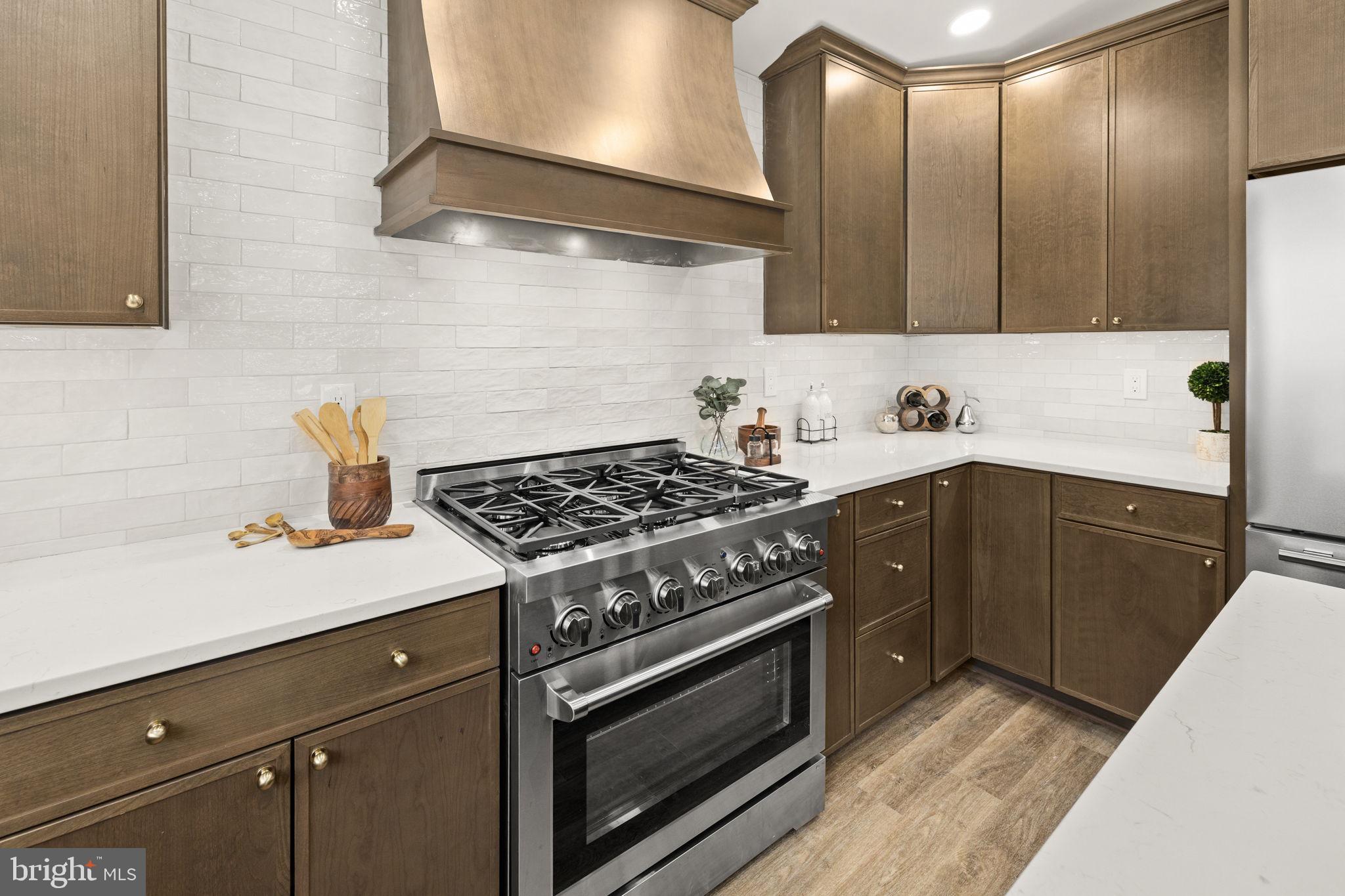 116 Washington Street Locust Grove, VA 22508 - Photo 32 of 130 a kitchen with a stove and a sink