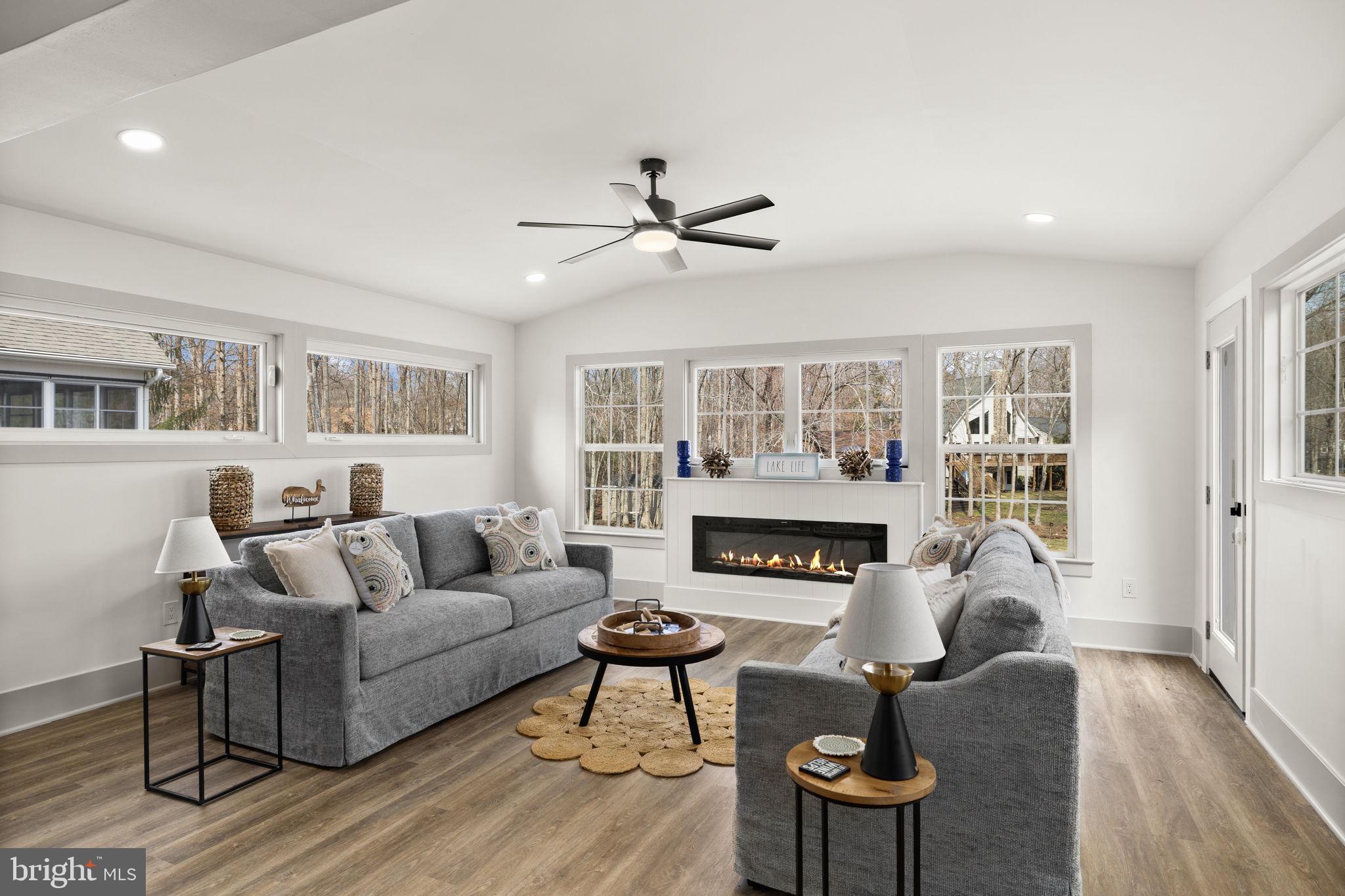 116 Washington Street Locust Grove, VA 22508 - Photo 43 of 130 a living room with furniture a fireplace and a large window