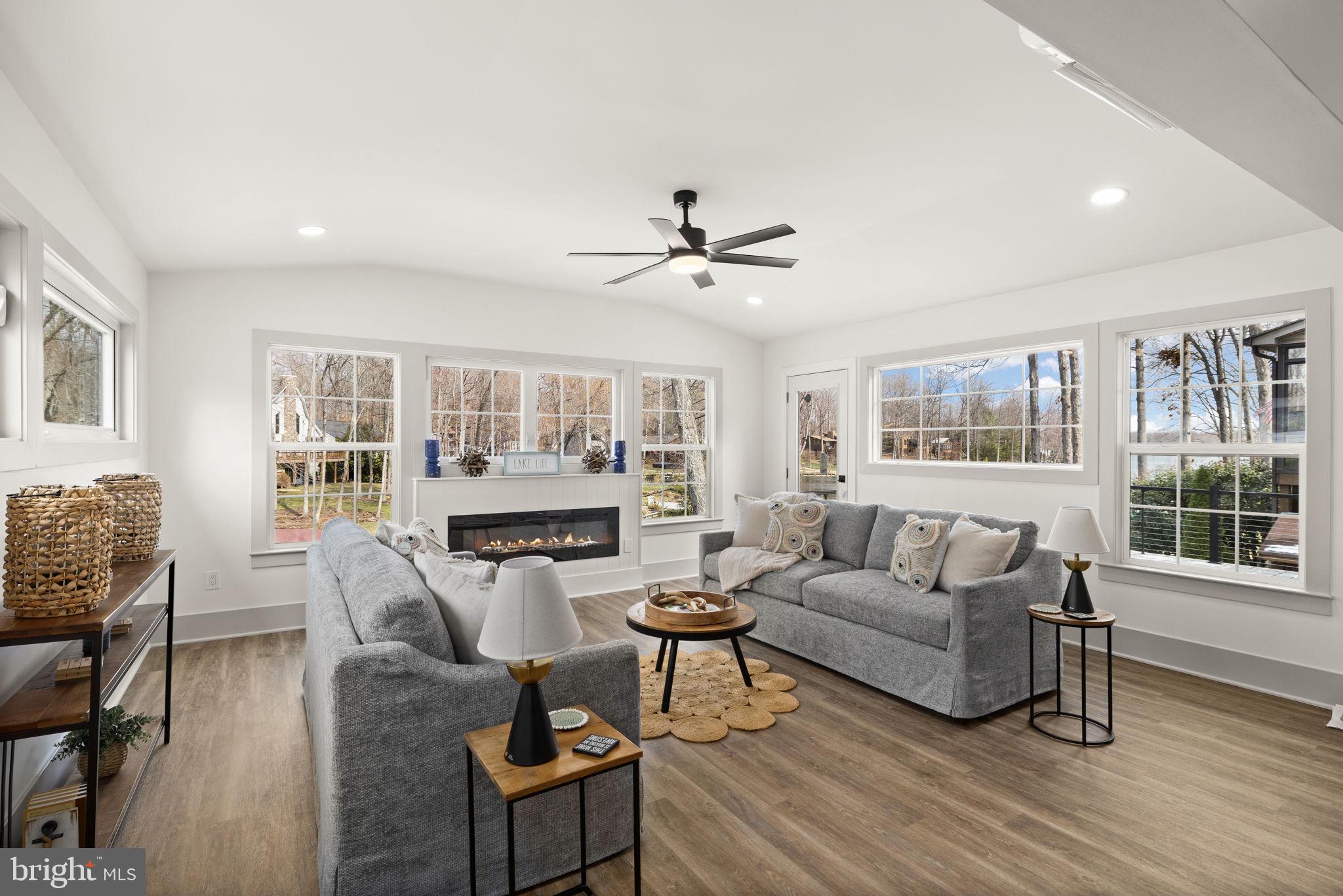 116 Washington Street Locust Grove, VA 22508 - Photo 45 of 130 a living room with furniture a fireplace and a flat screen tv