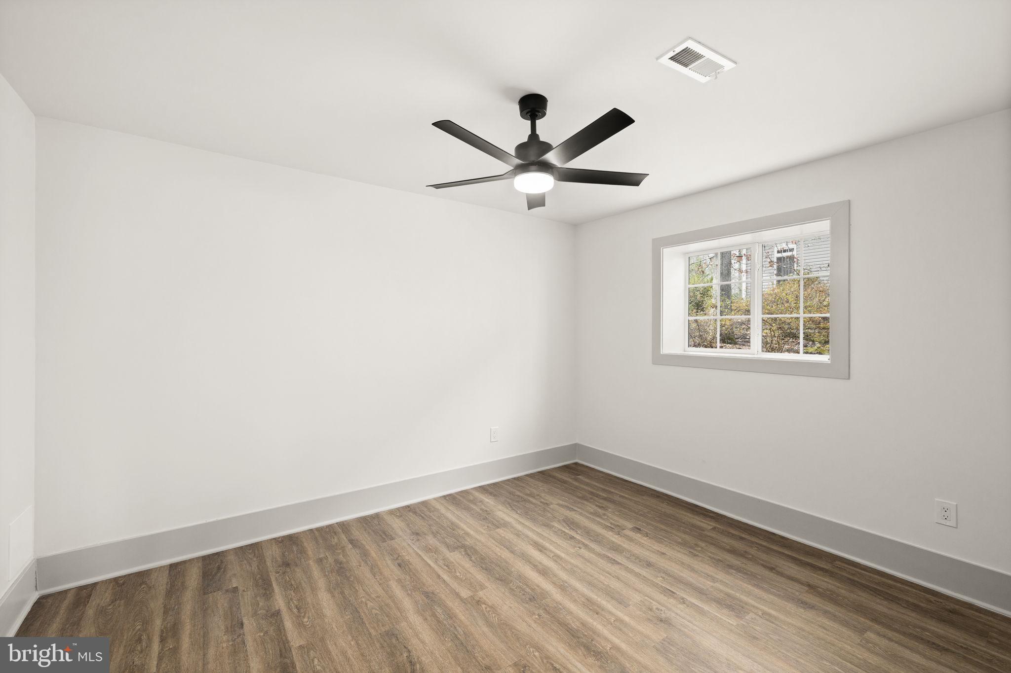 116 Washington Street Locust Grove, VA 22508 - Photo 74 of 130 wooden floor in an empty room with a window
