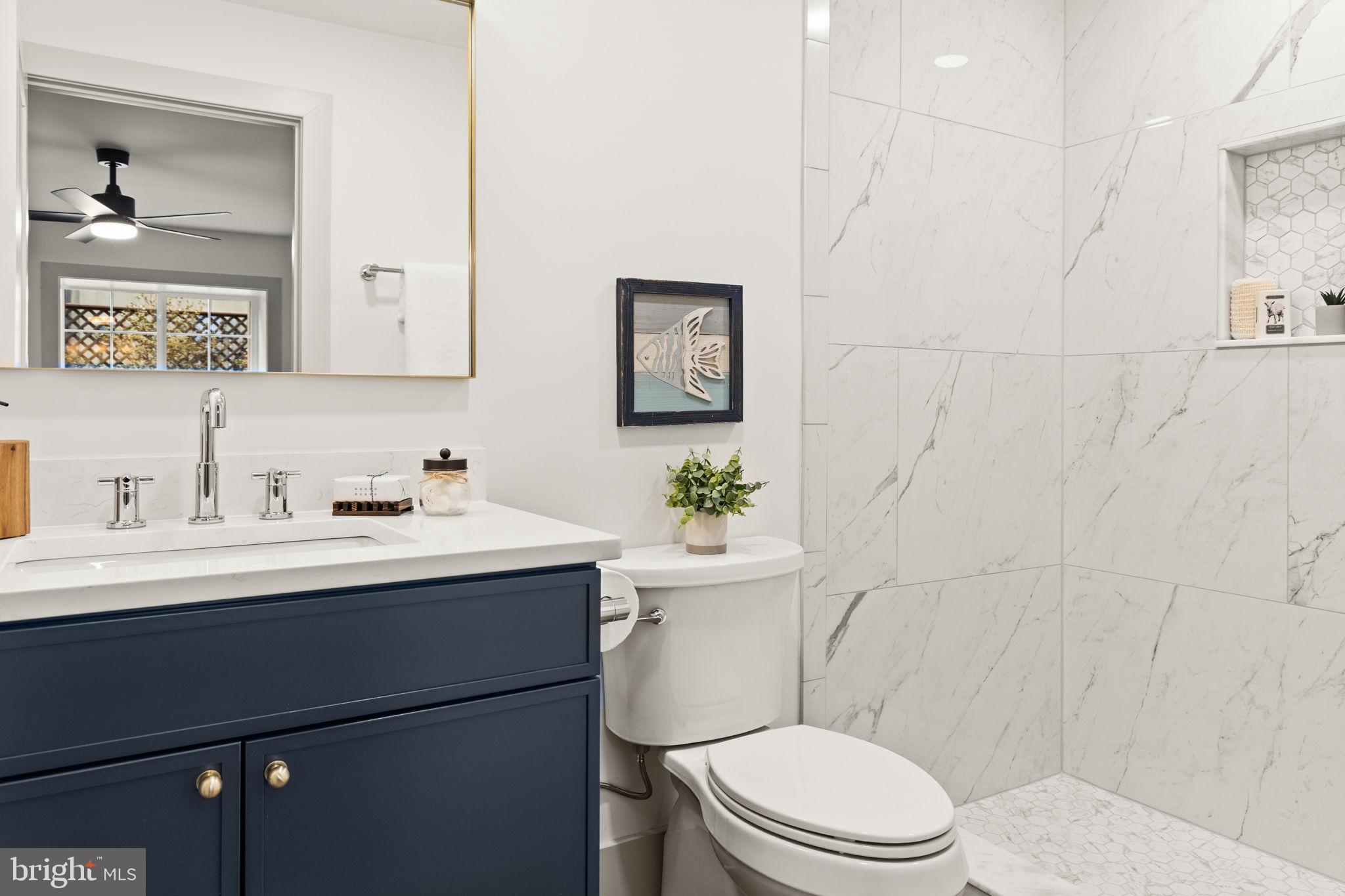 116 Washington Street Locust Grove, VA 22508 - Photo 81 of 130 a bathroom with a sink a toilet a mirror and shower