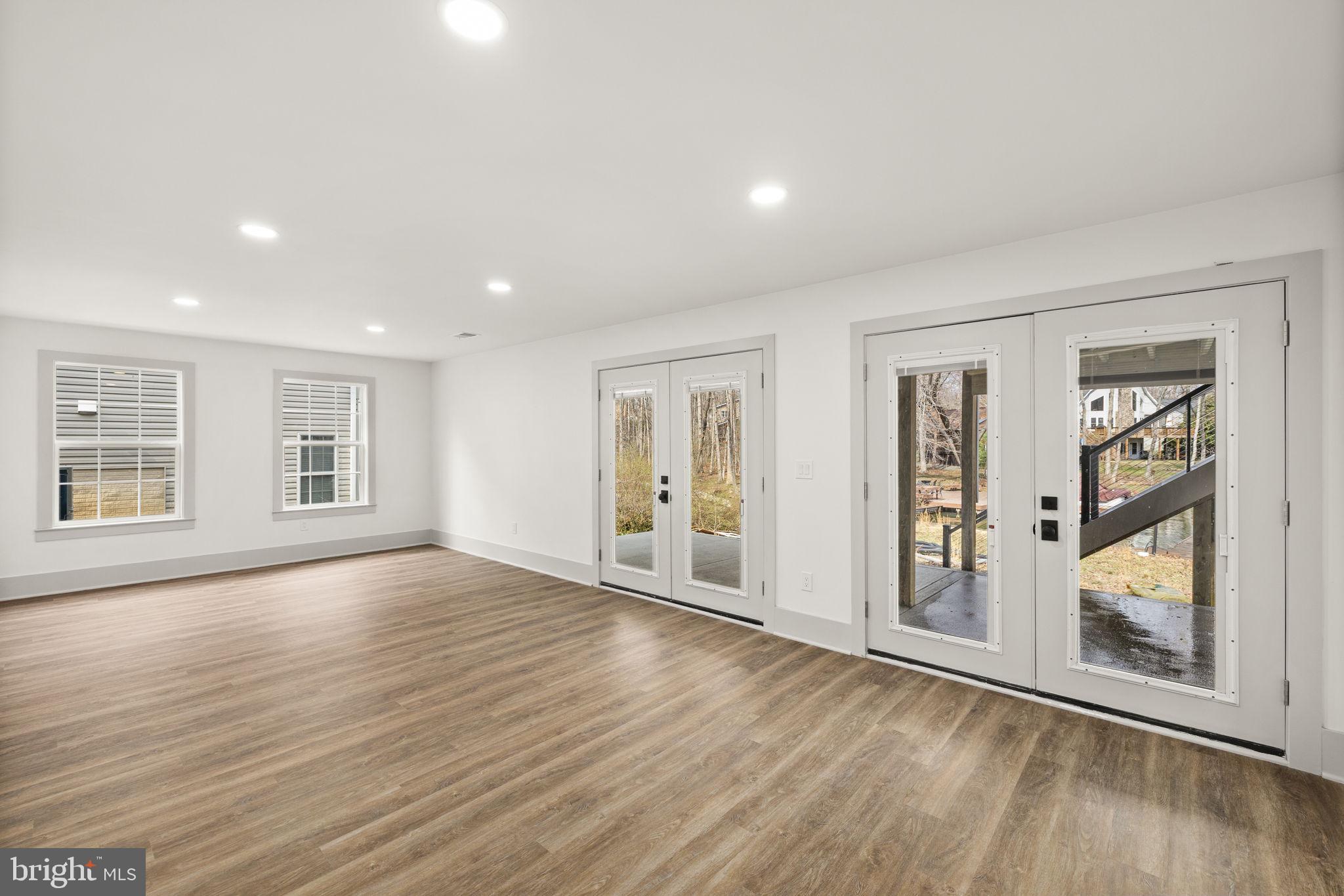 116 Washington Street Locust Grove, VA 22508 - Photo 85 of 130 a view of an empty room with wooden floor and a window