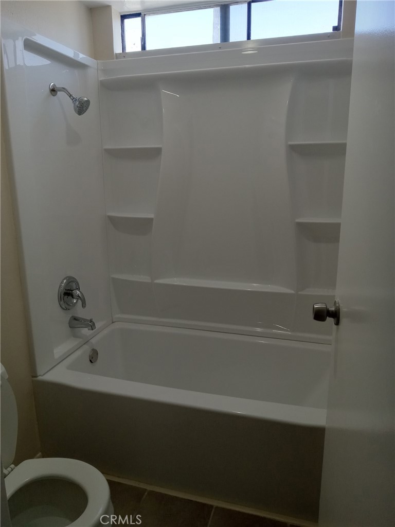 134 Racquet Club Drive Compton, CA 90220 - Photo 6 of 9 Newer floors and shower enclosure, 2nd bathroom