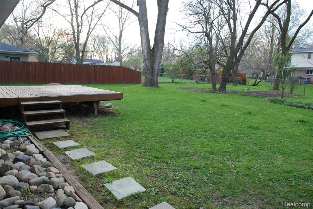 403 Trombley Road Troy, MI 48083 - Photo 3 of 10 DECK OFF BACK DOOR LEADING TO LARGE FENCED IN BACKYARD
