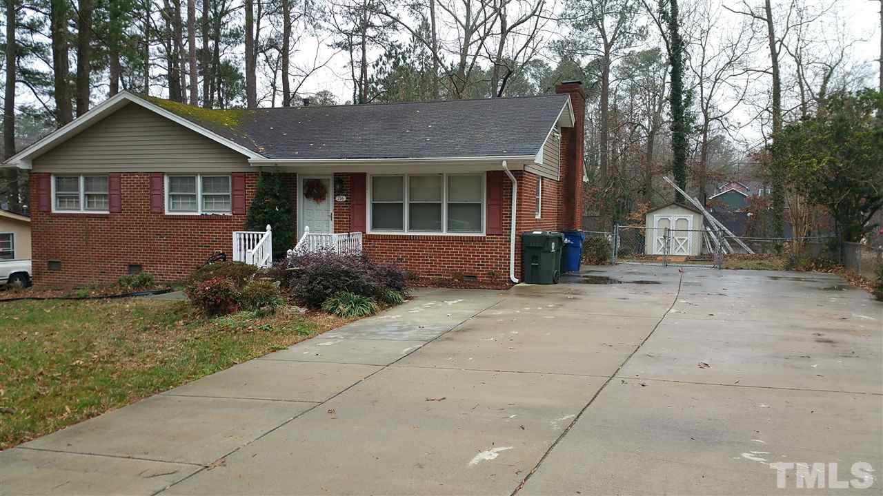 716 Cooper Road Raleigh, NC 27610 - Photo 2 of 25 a front view of a house with garden