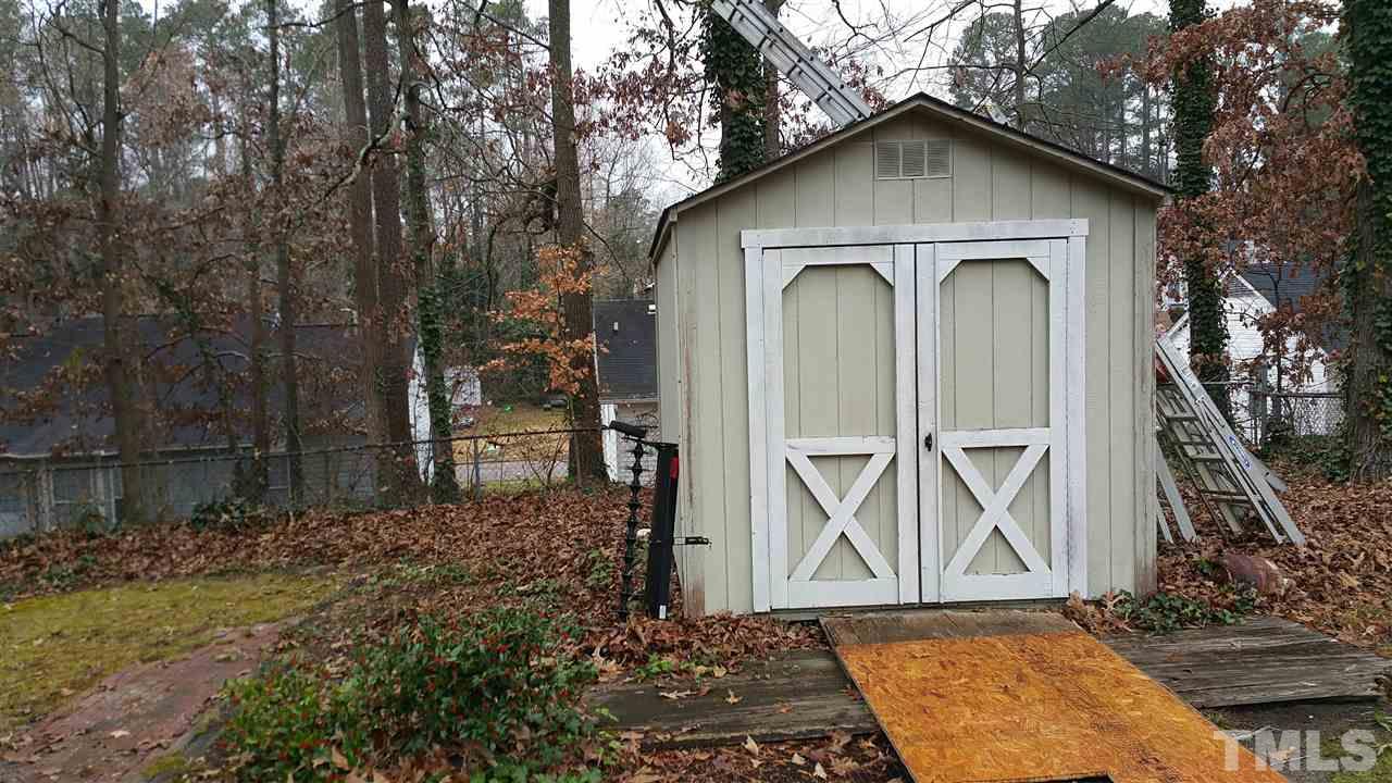 716 Cooper Road Raleigh, NC 27610 - Photo 18 of 25 a front view of a house with garden