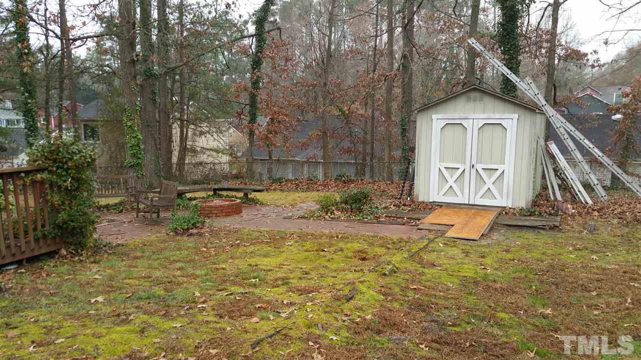 716 Cooper Road Raleigh, NC 27610 - Photo 19 of 25 a view of a house with a yard and sitting area