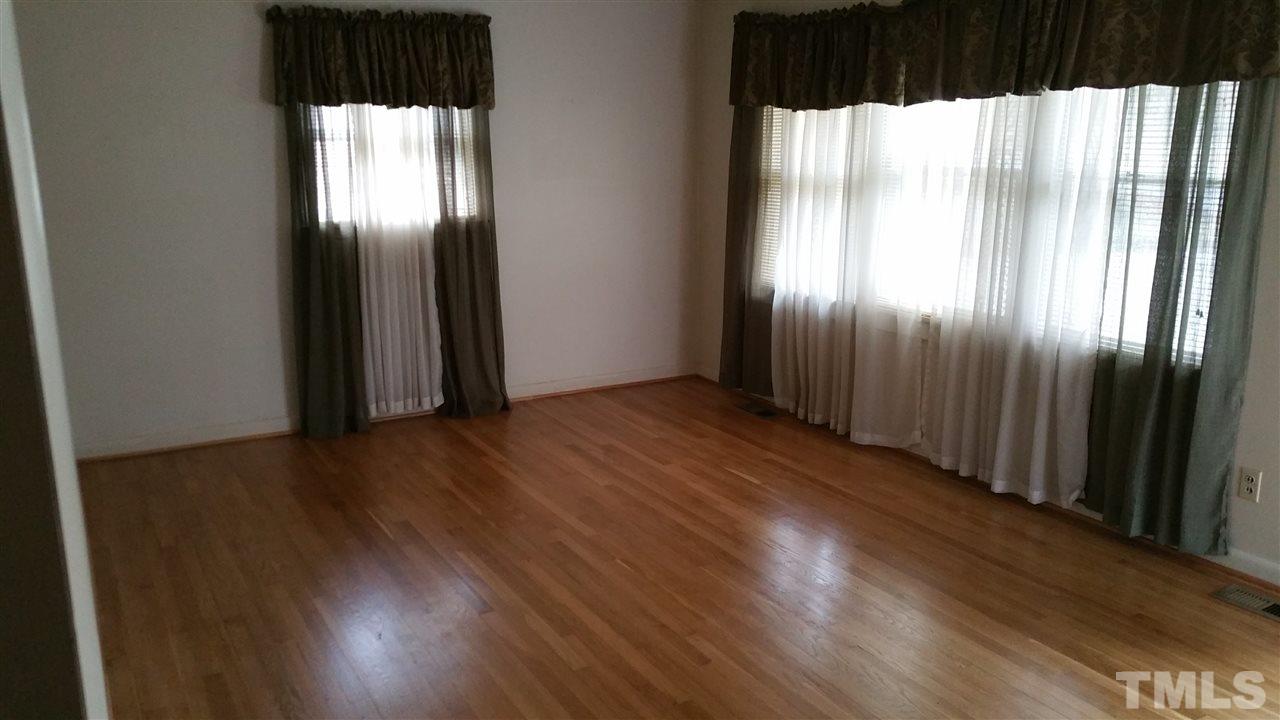 716 Cooper Road Raleigh, NC 27610 - Photo 3 of 25 a view of a large mirror and wooden floor