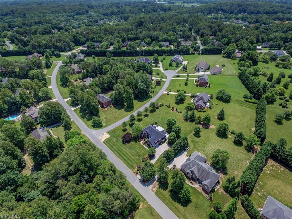 5501 Gray Leigh Drive Oak Ridge, NC 27310 - Photo 2 of 30 Aerial view of the home and surrounding neighborhood. Stafford Farm Estates remains one of Oak Ridge's finest neighborhoods and enjoys a prime, close to town location.