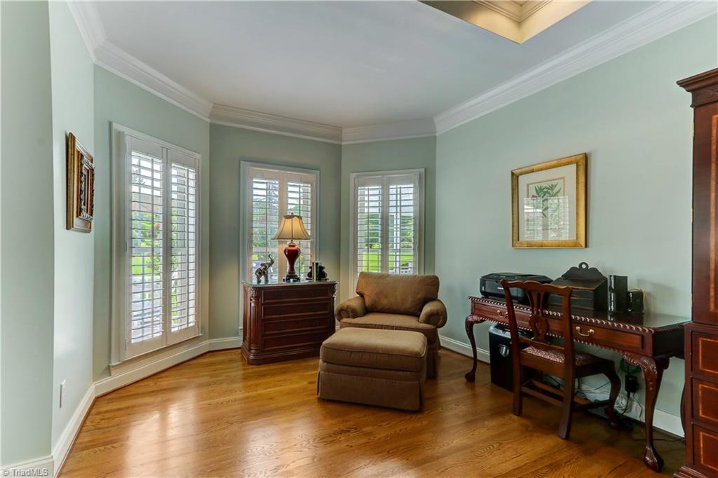 5501 Gray Leigh Drive Oak Ridge, NC 27310 - Photo 13 of 30 The Master Bedroom's sitting area offers a quiet spot to get away. Crown Molding, Over-sized windows with Plantation Shutters, and hardwood flooring.
