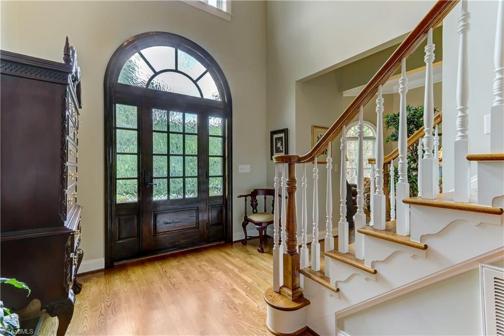5501 Gray Leigh Drive Oak Ridge, NC 27310 - Photo 3 of 30 Welcome your guests through this beautiful custom solid Mahogany door. Spacious entry and two hall closets.