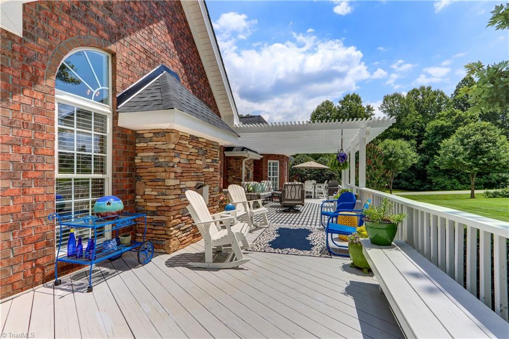 5501 Gray Leigh Drive Oak Ridge, NC 27310 - Photo 25 of 30 Another view of the deck showing the different areas for enjoyment.