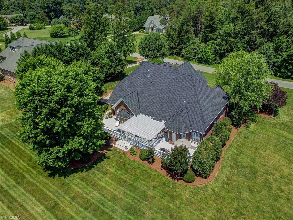 5501 Gray Leigh Drive Oak Ridge, NC 27310 - Photo 29 of 30 Aerial view of the back of the home.