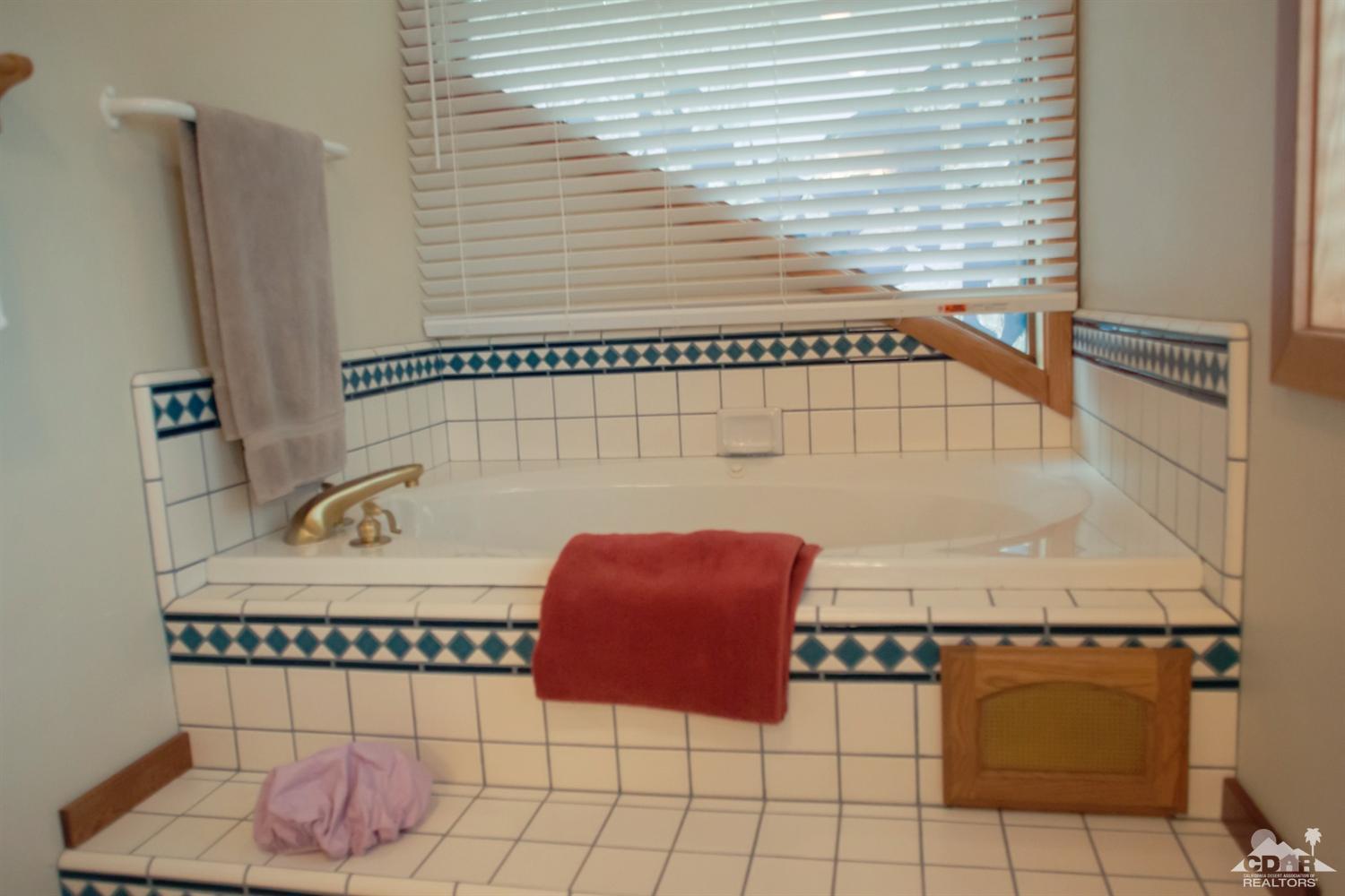 25037 Cougar Road Idyllwild, CA 92549 - Photo 11 of 73 a bathroom with a bathtub and shower