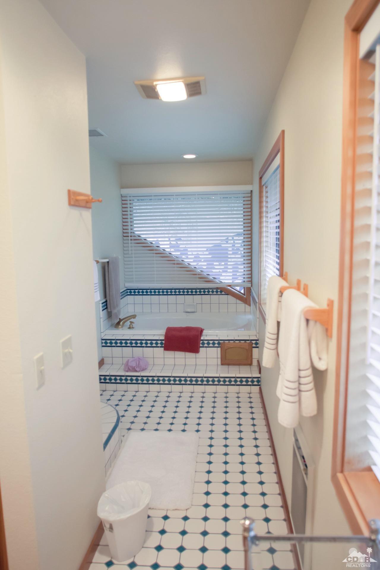 25037 Cougar Road Idyllwild, CA 92549 - Photo 12 of 73 a bathroom with a sink a toilet and a mirror
