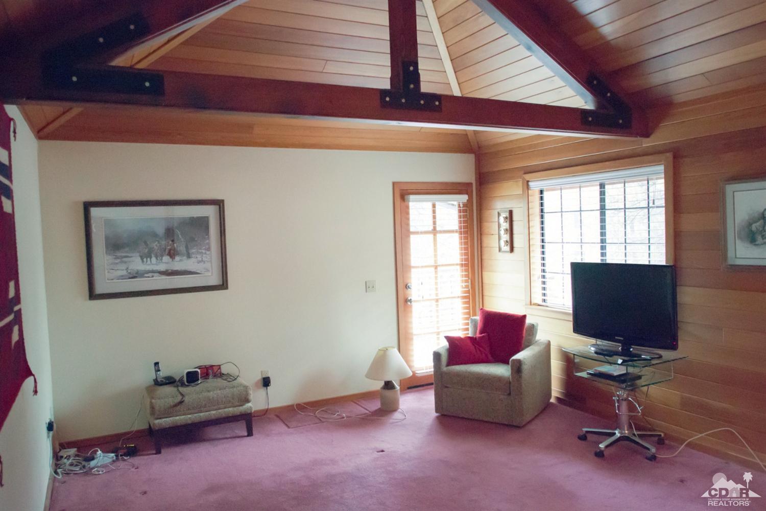 25037 Cougar Road Idyllwild, CA 92549 - Photo 20 of 73 a living room with furniture and a flat screen tv