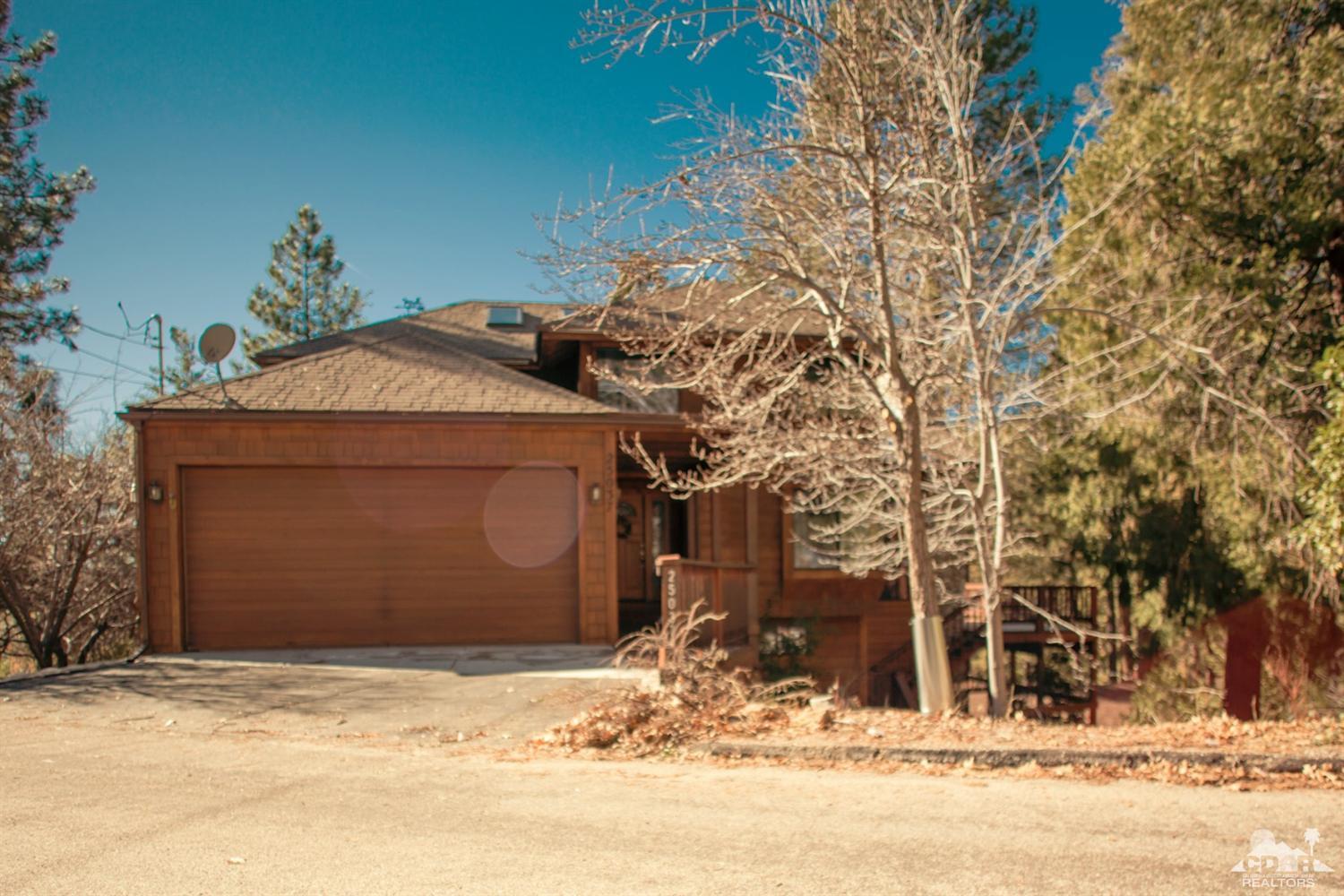 25037 Cougar Road Idyllwild, CA 92549 - Photo 2 of 73 a front view of a house with a yard