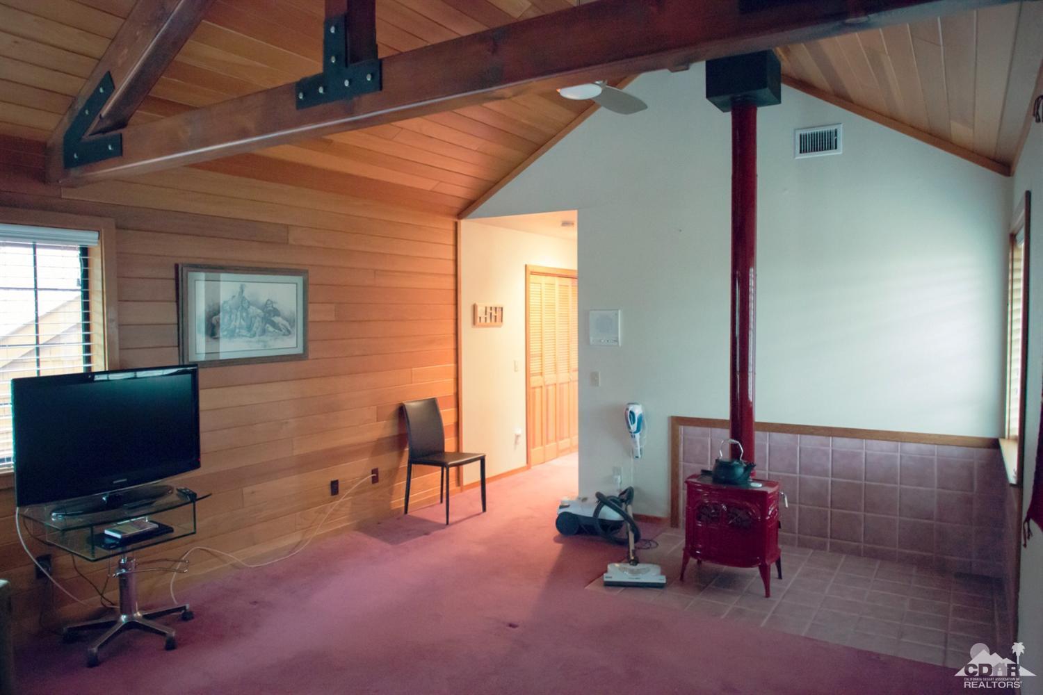 25037 Cougar Road Idyllwild, CA 92549 - Photo 21 of 73 a view of a livingroom with workspace and a window