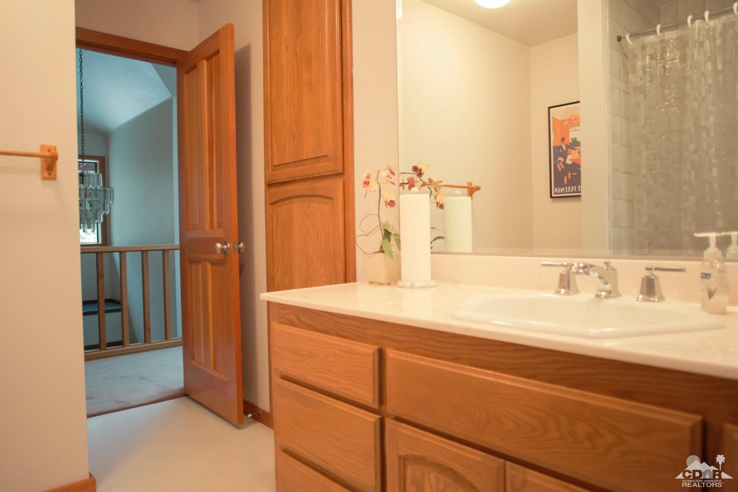 25037 Cougar Road Idyllwild, CA 92549 - Photo 26 of 73 a bathroom with a sink and a mirror