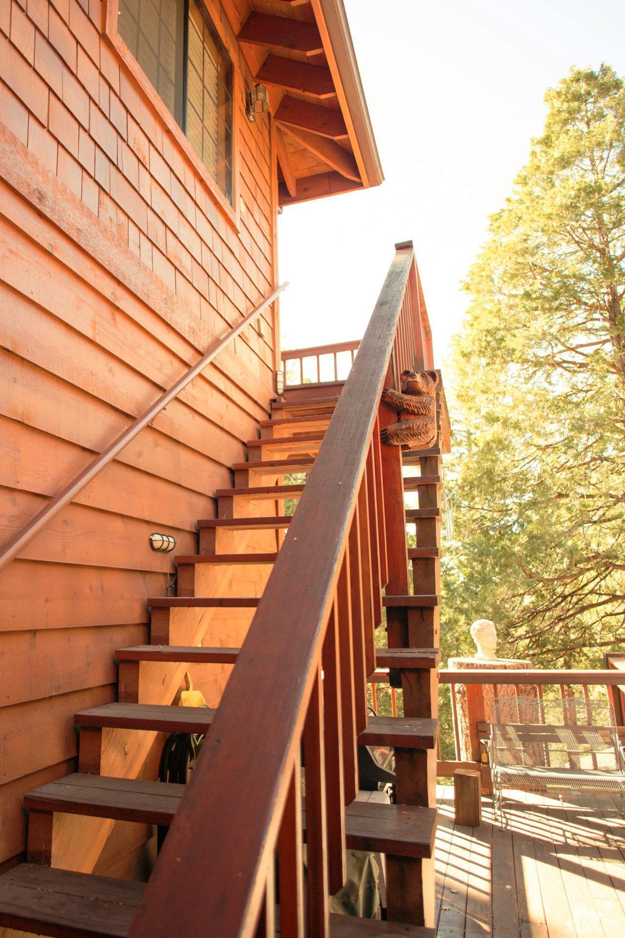 25037 Cougar Road Idyllwild, CA 92549 - Photo 31 of 73 a view of balcony with wooden floor and fence