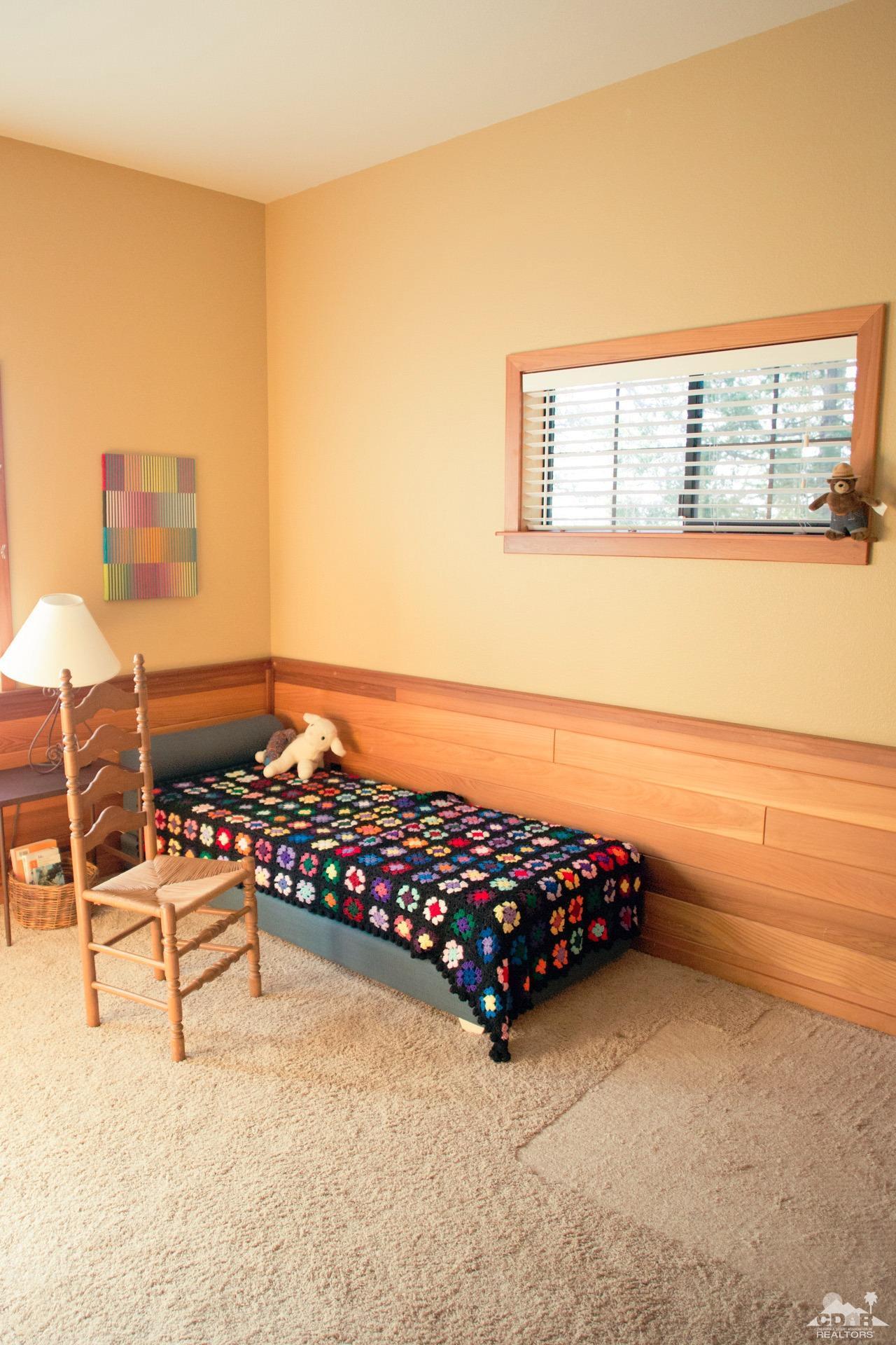 25037 Cougar Road Idyllwild, CA 92549 - Photo 44 of 73 a bedroom with furniture and a window