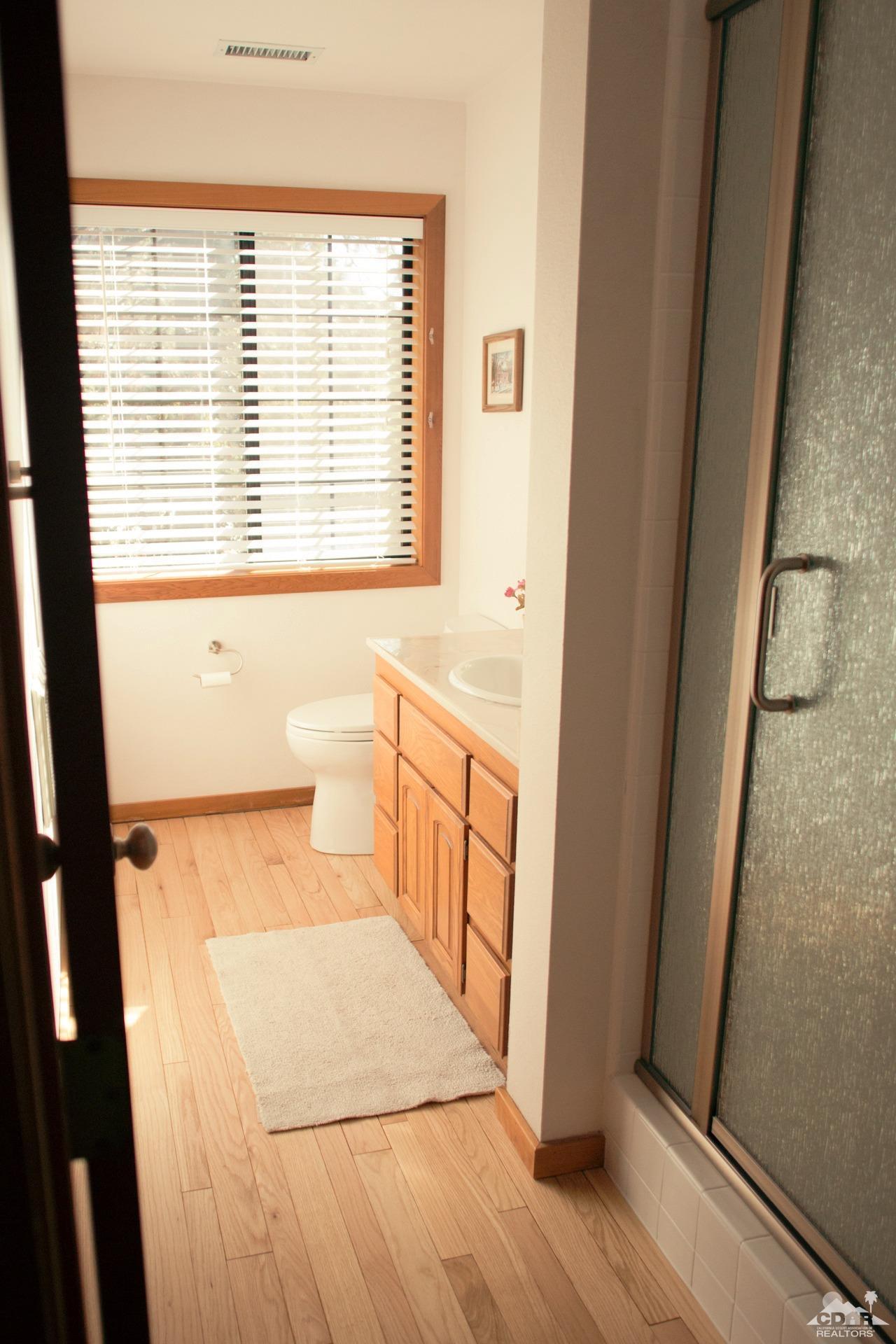 25037 Cougar Road Idyllwild, CA 92549 - Photo 46 of 73 a bathroom with a bathtub and a shower