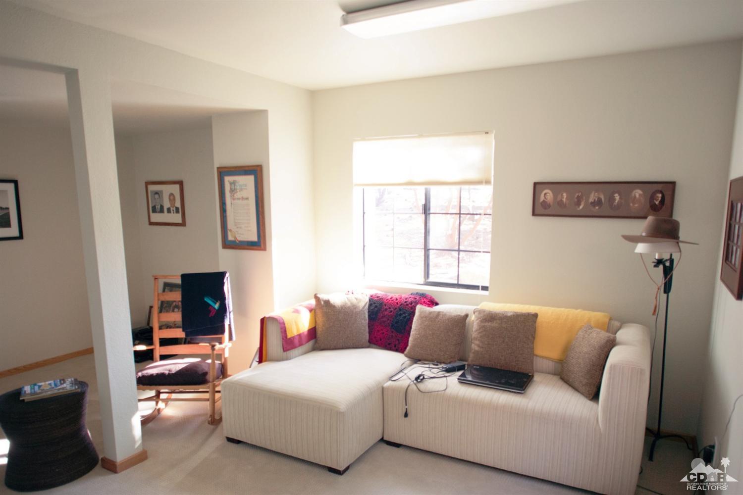 25037 Cougar Road Idyllwild, CA 92549 - Photo 49 of 73 a living room with a couch and a window