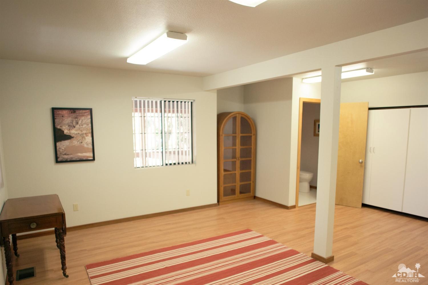 25037 Cougar Road Idyllwild, CA 92549 - Photo 54 of 73 a view of a room with wooden floor and window