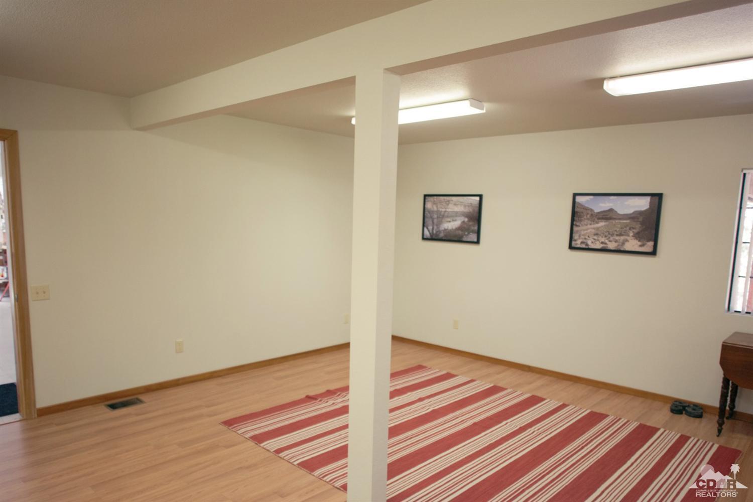 25037 Cougar Road Idyllwild, CA 92549 - Photo 55 of 73 a view of a room with wooden floor and chair