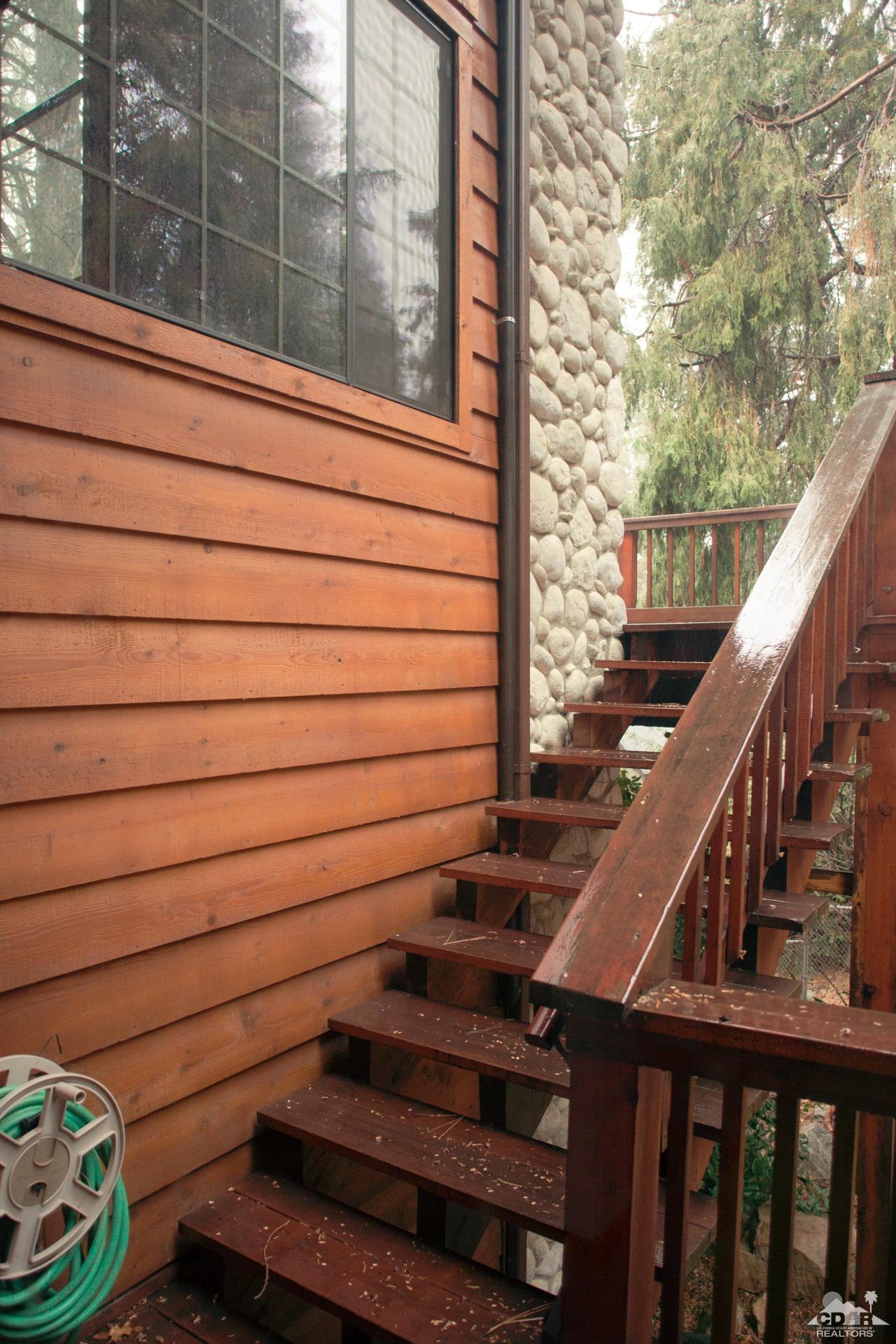 25037 Cougar Road Idyllwild, CA 92549 - Photo 6 of 73 a view of entryway with wooden stairs