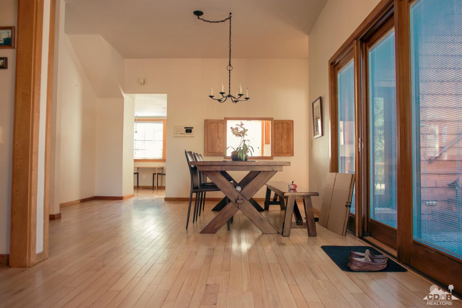 25037 Cougar Road Idyllwild, CA 92549 - Photo 63 of 73 a view of a dining room with furniture window and wooden floor