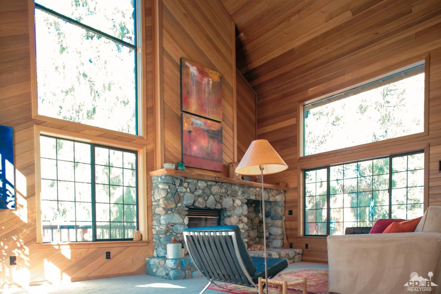 25037 Cougar Road Idyllwild, CA 92549 - Photo 66 of 73 a living room filled with furniture and a large window