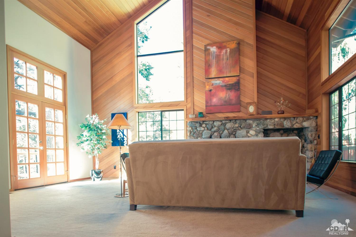 25037 Cougar Road Idyllwild, CA 92549 - Photo 68 of 73 a living room with furniture and windows