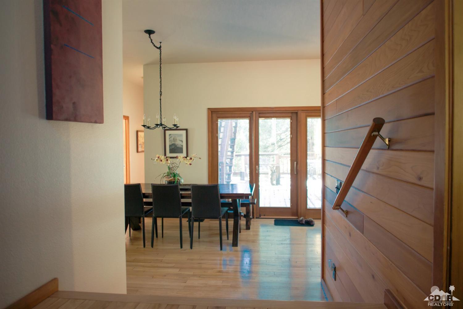 25037 Cougar Road Idyllwild, CA 92549 - Photo 72 of 73 a view of dining room with furniture and wooden floor