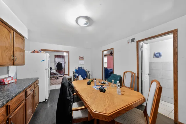 a view of a dining room with furniture and window