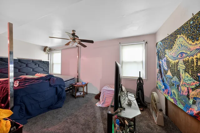 a bed room with a bed and a window