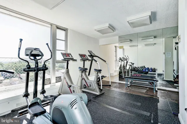 a room with table chairs and entryway
