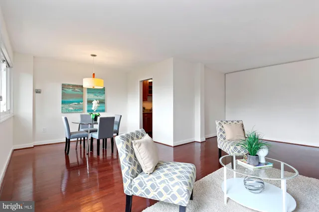 a view of a dining room with furniture window and wooden floor