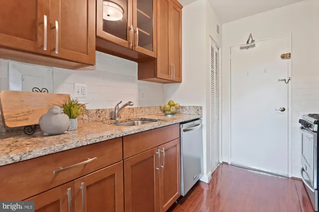 a hallway with sink and mirror