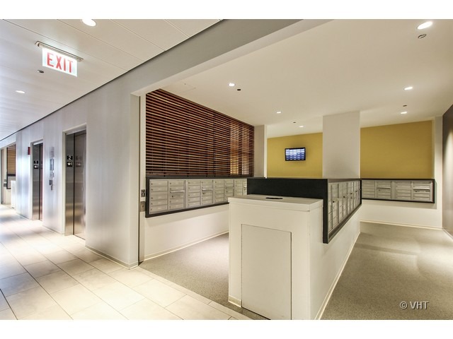 235 West Van Buren Street, Unit 3518 Chicago, IL 60607 - Photo 9 of 9 a view of a hallway with staircase