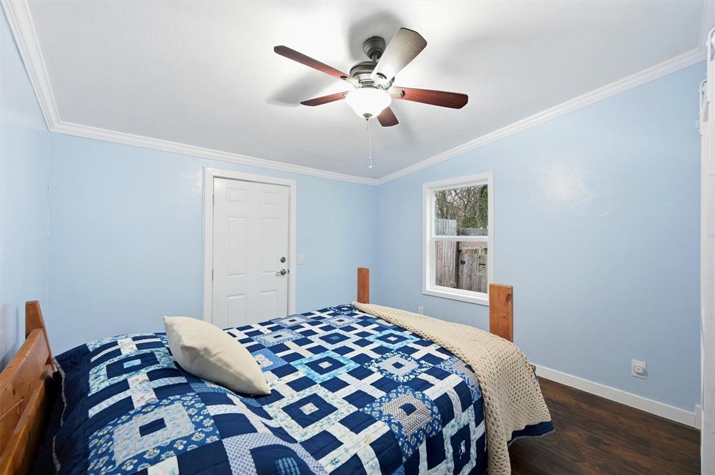 2421 Edwards Road Van Alstyne, TX 75495 - Photo 23 of 40 a bedroom with a bed and wooden floor