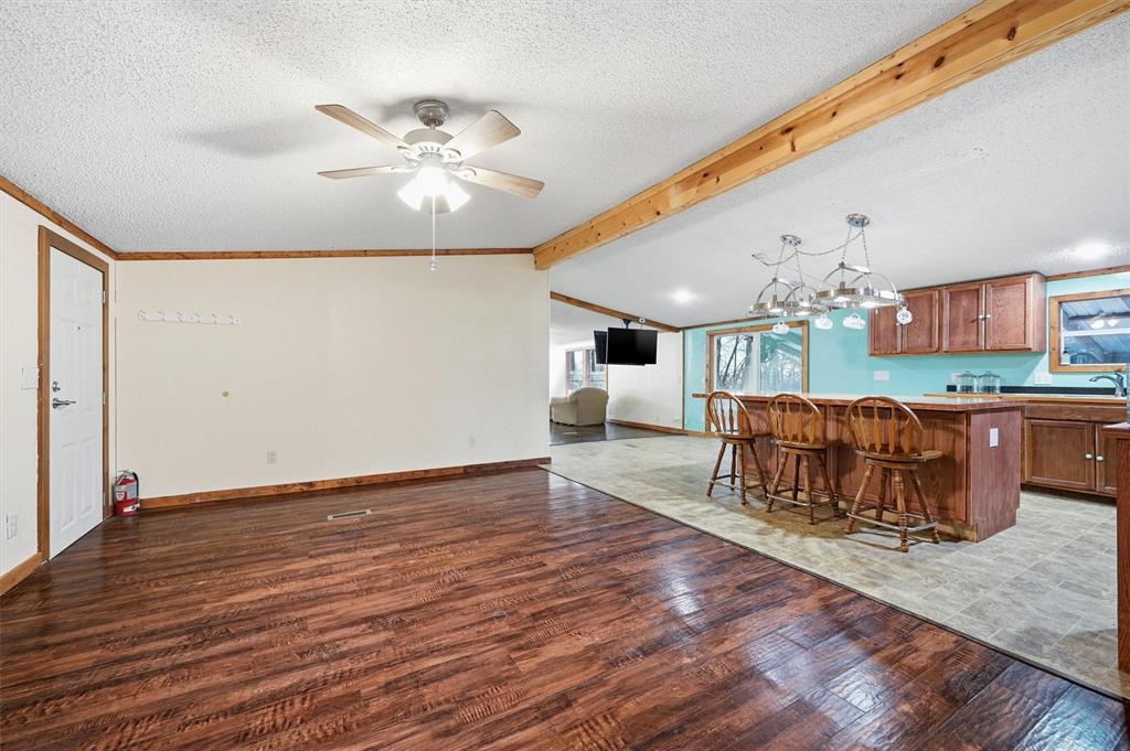 2421 Edwards Road Van Alstyne, TX 75495 - Photo 6 of 40 a view of a dining room with furniture and wooden floor