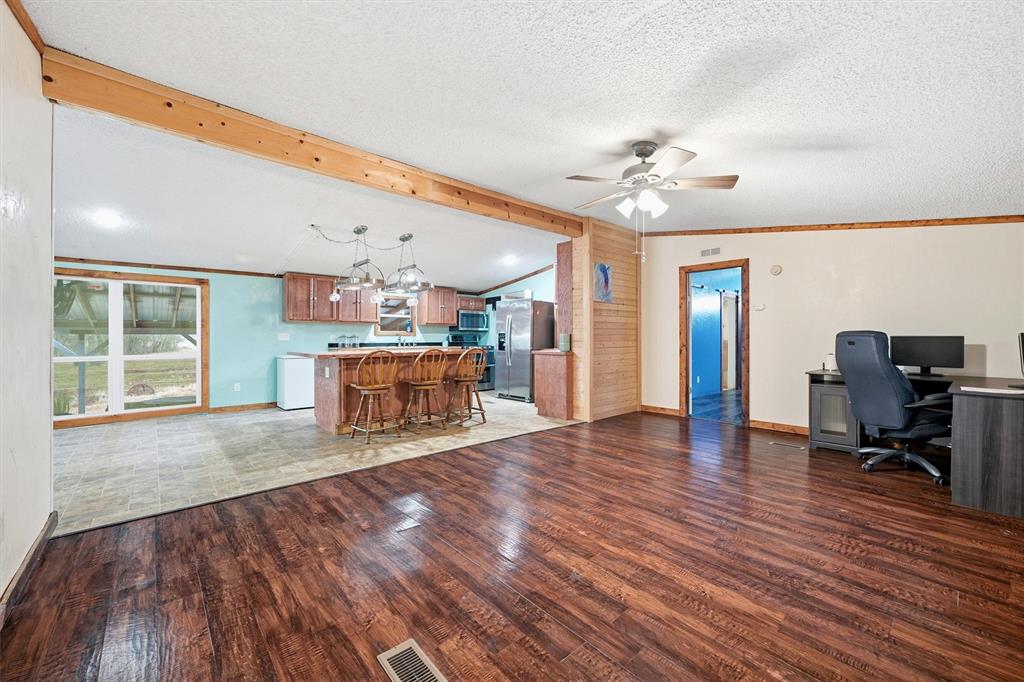 2421 Edwards Road Van Alstyne, TX 75495 - Photo 7 of 40 a living room with furniture and a wooden floor