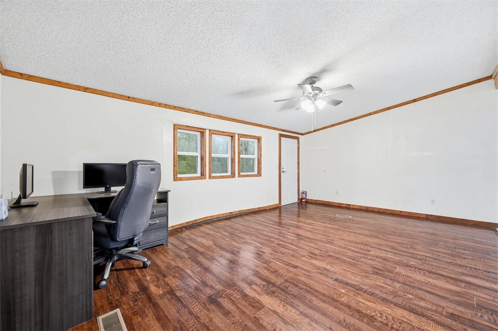 2421 Edwards Road Van Alstyne, TX 75495 - Photo 8 of 40 a view of a workspace with furniture and a window